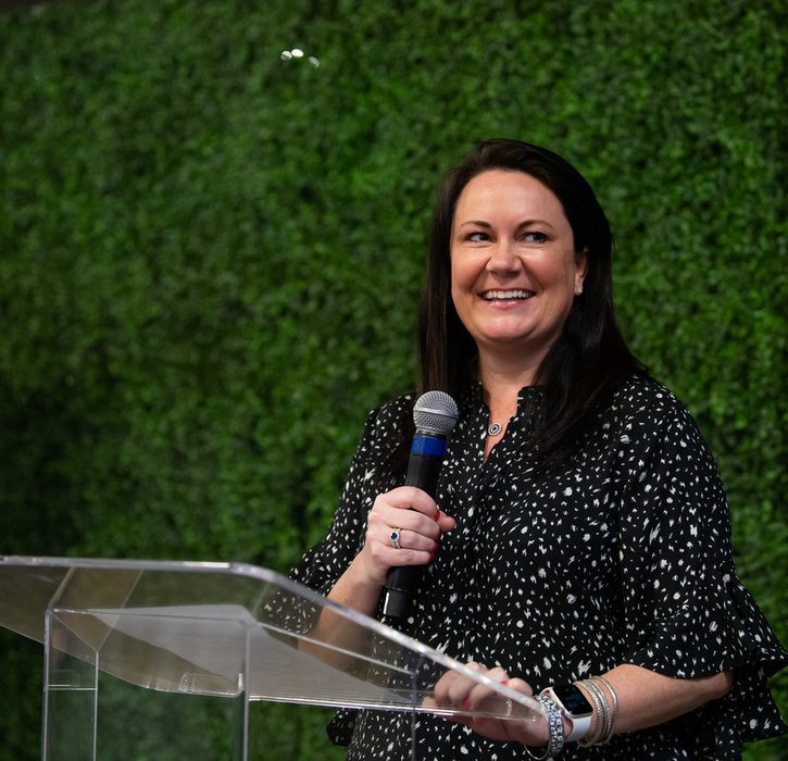 Woman speaking with a microphone